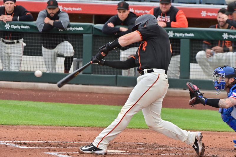 Mar 22, 2023; Scottsdale, Arizona, USA; San Francisco Giants catcher Joey Bart (21) flies out in the third inning against the San Francisco Giants during a Spring Training game at Scottsdale Stadium. Mandatory Credit: Matt Kartozian-USA TODAY Sports