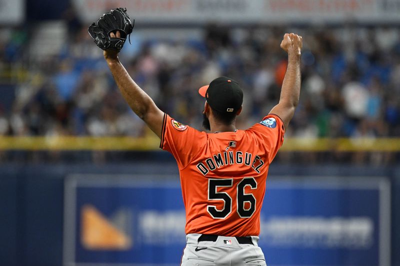 Aug 10, 2024; St. Petersburg, Florida, USA; Baltimore Orioles relief pitcher Sereanthony Dominguez (56) reacts after the last out against the Tampa Bay Rays at Tropicana Field. Mandatory Credit: Jonathan Dyer-USA TODAY Sports