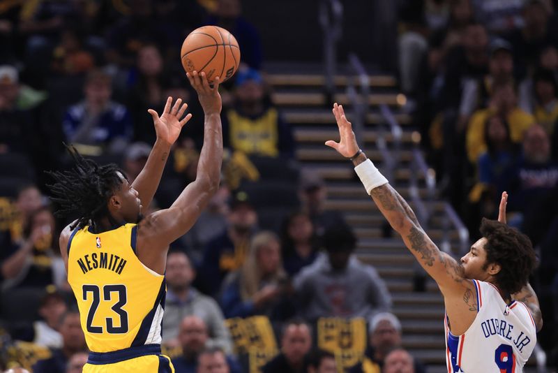 INDIANAPOLIS, INDIANA - OCTOBER 27: Aaron Nesmith #23 of the Indiana Pacers takes a shot over Kelly Oubre Jr. #9 of the Philadelphia 76ers during the first half at Gainbridge Fieldhouse on October 27, 2024 in Indianapolis, Indiana. NOTE TO USER: User expressly acknowledges and agrees that, by downloading and or using this photograph, User is consenting to the terms and conditions of the Getty Images License Agreement. (Photo by Justin Casterline/Getty Images)