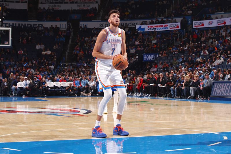 OKLAHOMA CITY, OK - OCTOBER 17: Chet Holmgren #7 of the Oklahoma City Thunder shoots a free throw at the game against the Atlanta Hawks on October 17, 2024 at Paycom Arena in Oklahoma City, Oklahoma. NOTE TO USER: User expressly acknowledges and agrees that, by downloading and or using this photograph, User is consenting to the terms and conditions of the Getty Images License Agreement. Mandatory Copyright Notice: Copyright 2024 NBAE (Photo by Zach Beeker/NBAE via Getty Images)