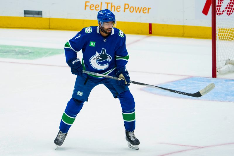 Sep 26, 2025; Vancouver, British Columbia, CAN; Vancouver Canucks defenseman Pierre Olivier Joseph (7) skates against the Seattle Kraken in the first period at Rogers Arena. Mandatory Credit: Bob Frid-Imagn Images