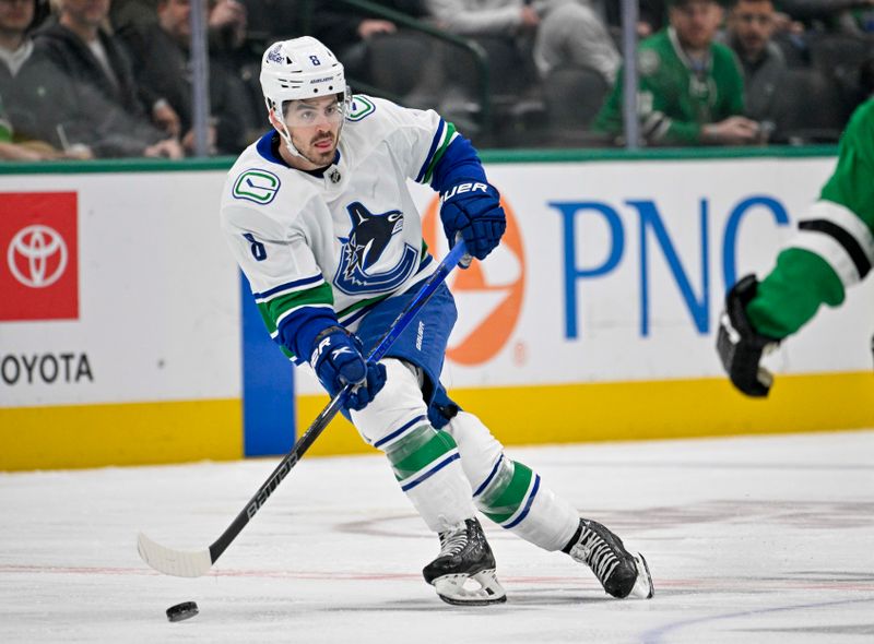 Dec 21, 2023; Dallas, Texas, USA; Vancouver Canucks right wing Conor Garland (8) skates against the Dallas Stars during the first period at the American Airlines Center. Mandatory Credit: Jerome Miron-USA TODAY Sports