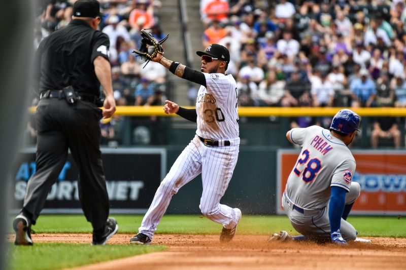 May 28, 2023; Denver, Colorado, USA; New York Mets left fielder Tommy Pham (28) steals second as Colorado Rockies second baseman Harold Castro (30) gets the throw late in the second inning at Coors Field. Mandatory Credit: John Leyba-USA TODAY Sports