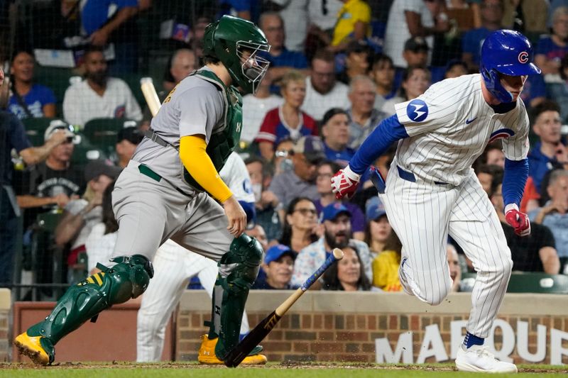 Sep 16, 2024; Chicago, Illinois, USA;  Chicago Cubs outfielder Pete Crow-Armstrong (52) bunts a single against the Oakland Athletics during the second inning at Wrigley Field. Mandatory Credit: David Banks-Imagn Images