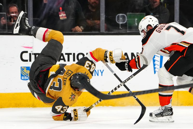 Apr 18, 2024; Las Vegas, Nevada, USA; Anaheim Ducks defenseman Radko Gudas (7) checks Vegas Golden Knights center Paul Cotter (43) during the second period at T-Mobile Arena. Mandatory Credit: Stephen R. Sylvanie-USA TODAY Sports