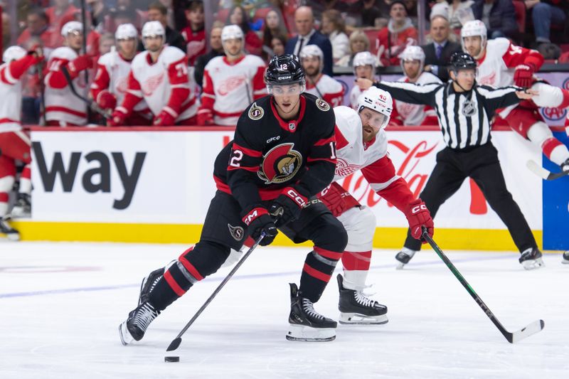 Dec 5, 2024; Ottawa, Ontario, CAN;  Ottawa Senators center Shane Pinto (12) skates with the puck in front of Detroit Red Wings defenseman Jeff Petry (46) in the first period at the Canadian Tire Centre. Mandatory Credit: Marc DesRosiers-Imagn Images