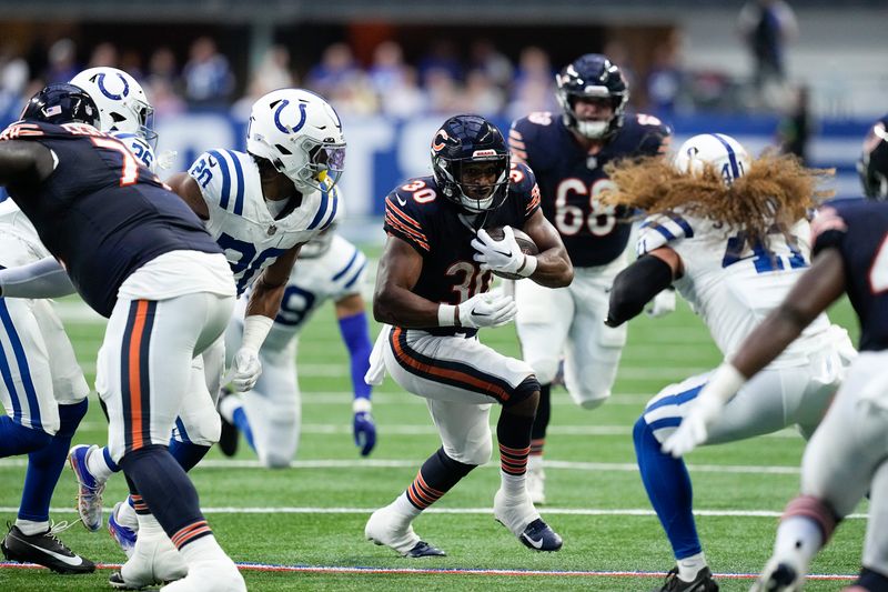 Chicago Bears running back Roschon Johnson (30) in action during an NFL preseason football game between the Chicago Bears and the Indianapolis Colts in Indianapolis, Saturday, Aug. 19, 2023. (AP Photo/Darron Cummings)