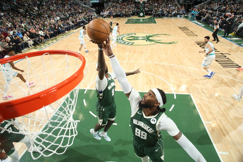 MILWAUKEE, WI - FEBRUARY 27: Jae Crowder #99 of the Milwaukee Bucks  rebounds the ball during the game against the Charlotte Hornets on February 27, 2024 at the Fiserv Forum Center in Milwaukee, Wisconsin. NOTE TO USER: User expressly acknowledges and agrees that, by downloading and or using this Photograph, user is consenting to the terms and conditions of the Getty Images License Agreement. Mandatory Copyright Notice: Copyright 2024 NBAE (Photo by Gary Dineen/NBAE via Getty Images).