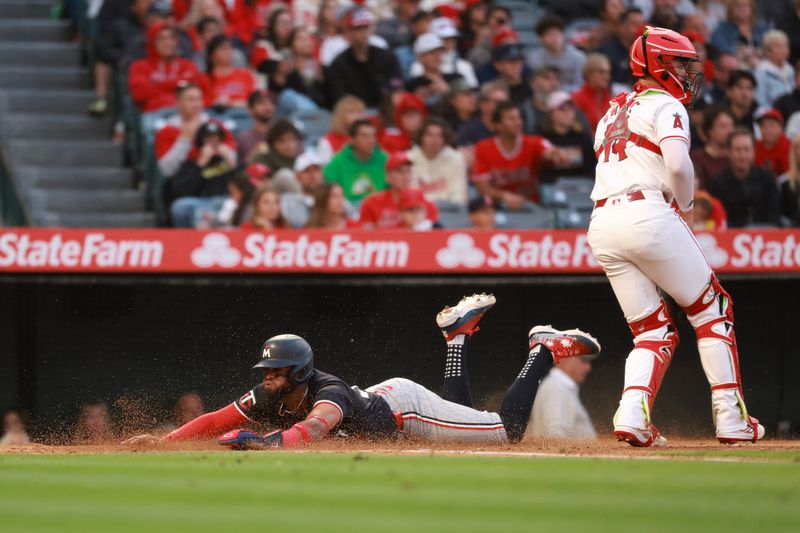 Apr 26, 2024; Anaheim, California, USA;  Minnesota Twins shortstop Willi Castro (50) scores a run during the third inning against the Los Angeles Angels at Angel Stadium. Mandatory Credit: Kiyoshi Mio-USA TODAY Sports