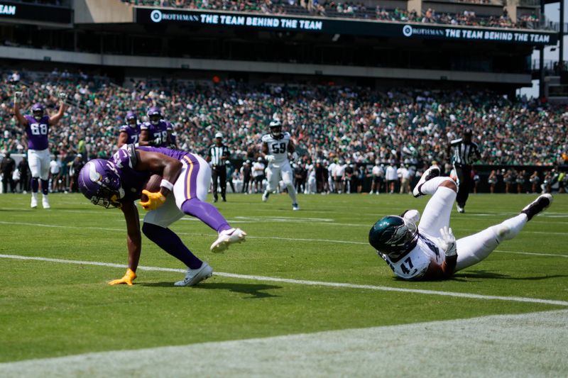 Minnesota Vikings wide receiver Justin Hall scores a touchdown during the first half of a preseason NFL football game against the Philadelphia Eagles on Saturday, Aug. 24, 2024, in Philadelphia. (AP Photo/Matt Rourke)