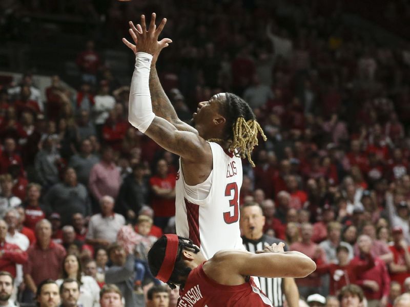 Mar 9, 2024; Tuscaloosa, Alabama, USA; Arkansas guard El Ellis (3) grabs a loose ball away from Alabama forward Jarin Stevenson (15) at Coleman Coliseum. Alabama came from behind to win on overtime 92-88. Mandatory Credit: Gary Cosby Jr.-USA TODAY Sports