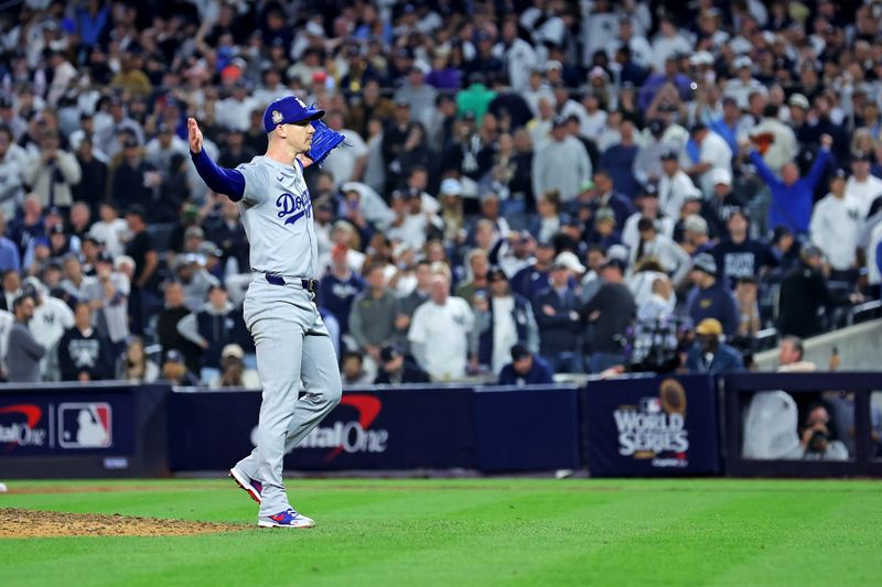 Oct 30, 2024; New York, New York, USA; Los Angeles Dodgers pitcher Walker Buehler (21) celebrates after beating the New York Yankees in game four to win the 2024 MLB World Series at Yankee Stadium. Mandatory Credit: Brad Penner-Imagn Images