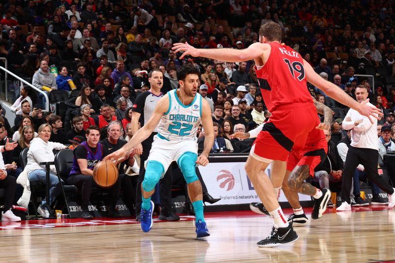 TORONTO, CANADA - MARCH 3: Vasilije Micic #22 of the Charlotte Hornets dribbles the ball during the game against the Toronto Raptors on March 3, 2024 at the Scotiabank Arena in Toronto, Ontario, Canada.  NOTE TO USER: User expressly acknowledges and agrees that, by downloading and or using this Photograph, user is consenting to the terms and conditions of the Getty Images License Agreement.  Mandatory Copyright Notice: Copyright 2024 NBAE (Photo by Vaughn Ridley/NBAE via Getty Images)