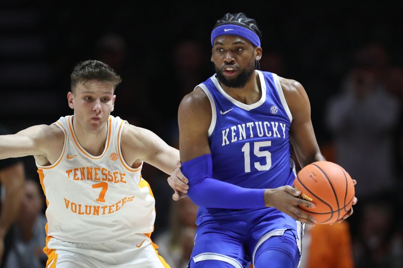 Jan 28, 2025; Knoxville, Tennessee, USA; Kentucky Wildcats forward Ansley Almonor (15) moves the ball against Tennessee Volunteers forward Igor Milicic Jr. (7) during the first half at Thompson-Boling Arena at Food City Center. Mandatory Credit: Randy Sartin-Imagn Images