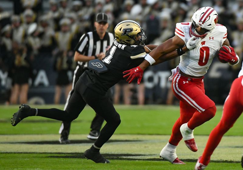 Sep 22, 2023; West Lafayette, Indiana, USA; Purdue Boilermakers cornerback Markevious Brown (1) is called for a facemask penalty against Wisconsin Badgers running back Braelon Allen (0) during the first half at Ross-Ade Stadium. Mandatory Credit: Robert Goddin-USA TODAY Sports