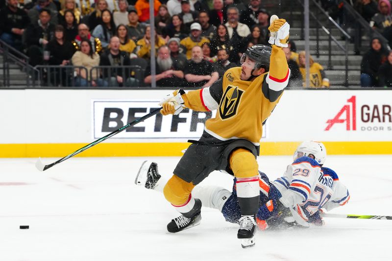 Feb 6, 2024; Las Vegas, Nevada, USA; Edmonton Oilers center Leon Draisaitl (29) breaks up a scoring chance by Vegas Golden Knights center Chandler Stephenson (20) during the third period at T-Mobile Arena. Mandatory Credit: Stephen R. Sylvanie-USA TODAY Sports