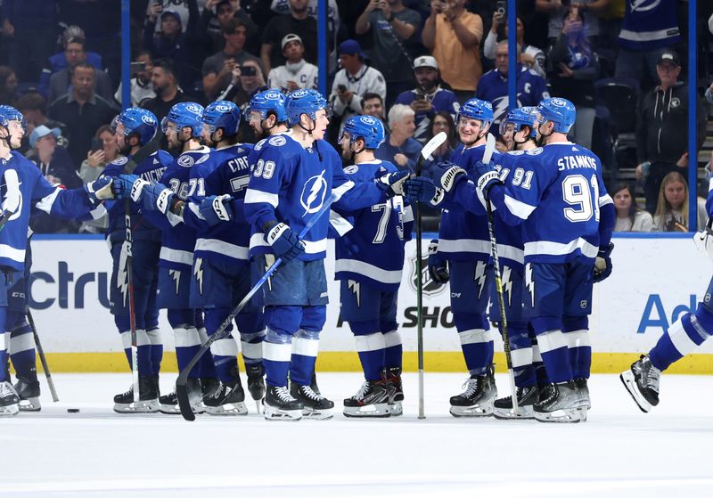 Jan 27, 2024; Tampa, Florida, USA; Tampa Bay Lightning center Waltteri Merela (39), center Steven Stamkos (91) is congratulated by teammates against the New Jersey Devils during the third period at Amalie Arena. Mandatory Credit: Kim Klement Neitzel-USA TODAY Sports