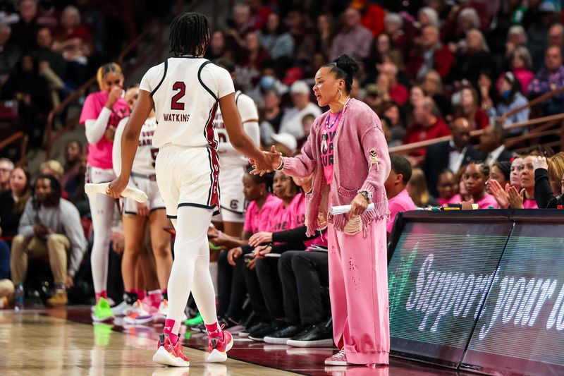 Feb 4, 2024; Columbia, South Carolina, USA; South Carolina Gamecocks head coach Dawn Staley greets forward Ashlyn Watkins (2) as she leaves the game against the Ole Miss Rebels in the second half at Colonial Life Arena. Mandatory Credit: Jeff Blake-USA TODAY Sports