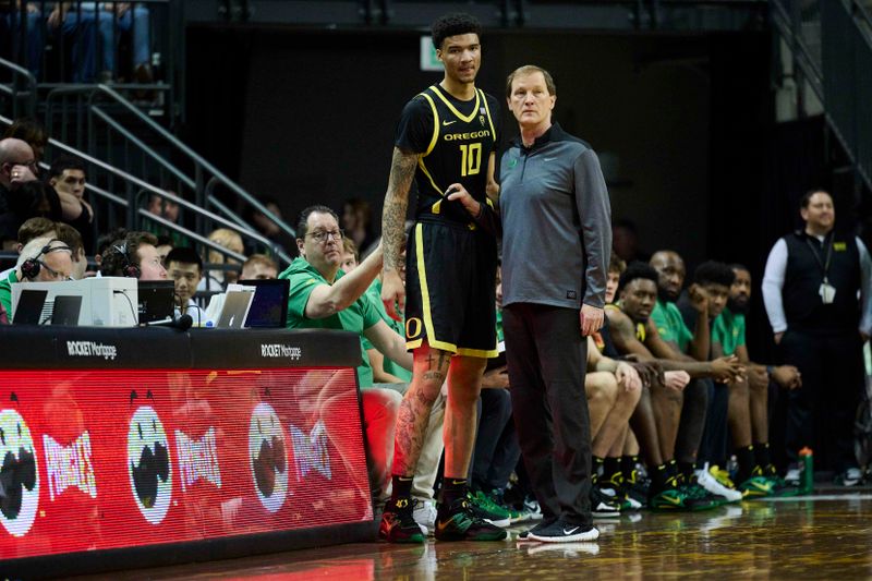 Feb 11, 2023; Eugene, Oregon, USA; Oregon Ducks head coach Dana Altman stands with Oregon Ducks center Kel'el Ware (10) during the first half against the UCLA Bruins at Matthew Knight Arena. Mandatory Credit: Troy Wayrynen-USA TODAY Sports