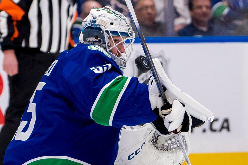 Apr 16, 2024; Vancouver, British Columbia, CAN; Vancouver Canucks goalie Thatcher Demko (35) makes a save against the Calgary Flames in the second period at Rogers Arena. Mandatory Credit: Bob Frid-USA TODAY Sports