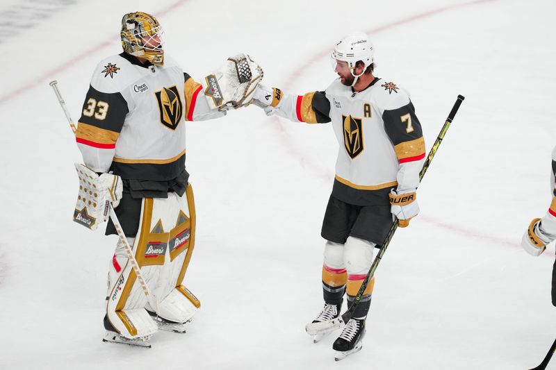 Oct 25, 2024; Las Vegas, Nevada, USA; Vegas Golden Knights goaltender Adin Hill (33) celebrates with Vegas Golden Knights defenseman Alex Pietrangelo (7) after the Golden Knights defeated the Ottawa Senators at T-Mobile Arena. Mandatory Credit: Stephen R. Sylvanie-Imagn Images