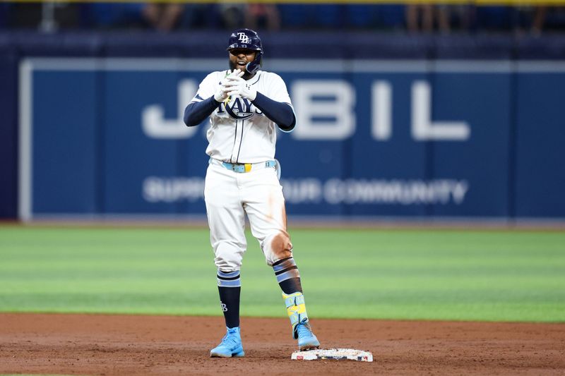 Sep 2, 2024; St. Petersburg, Florida, USA; Tampa Bay Rays third baseman Junior Caminero (13) reacts after hitting an rbi double against the Minnesota Twins in the second inning at Tropicana Field. Mandatory Credit: Nathan Ray Seebeck-USA TODAY Sports