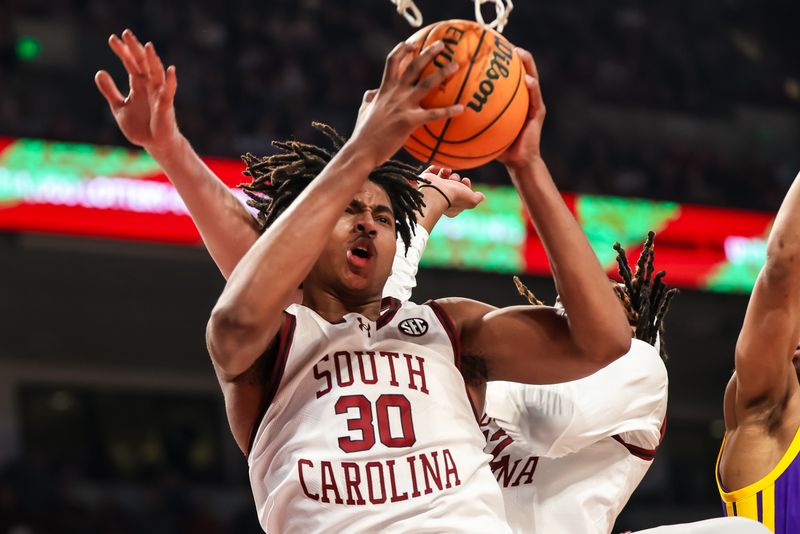 Feb 17, 2024; Columbia, South Carolina, USA; South Carolina Gamecocks forward Collin Murray-Boyles (30) grabs a rebound against the LSU Tigers in the first half at Colonial Life Arena. Mandatory Credit: Jeff Blake-USA TODAY Sports