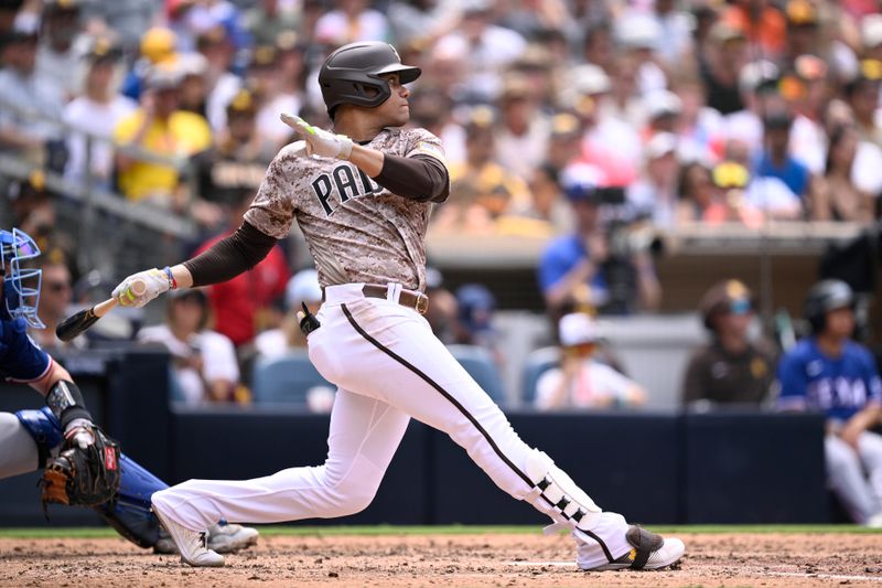 Jul 30, 2023; San Diego, California, USA; San Diego Padres left fielder Juan Soto (22) hits an RBI double against the Texas Rangers during the fourth inning at Petco Park. Mandatory Credit: Orlando Ramirez-USA TODAY Sports