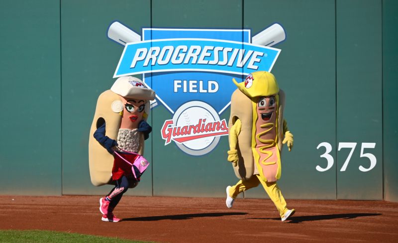 Oct 5, 2024; Cleveland, Ohio, USA; Hot dog mascots race between innings in game one of the ALDS for the 2024 MLB Playoffs between the Detroit Tigers and Cleveland Guardians at Progressive Field. Mandatory Credit: David Richard-Imagn Images