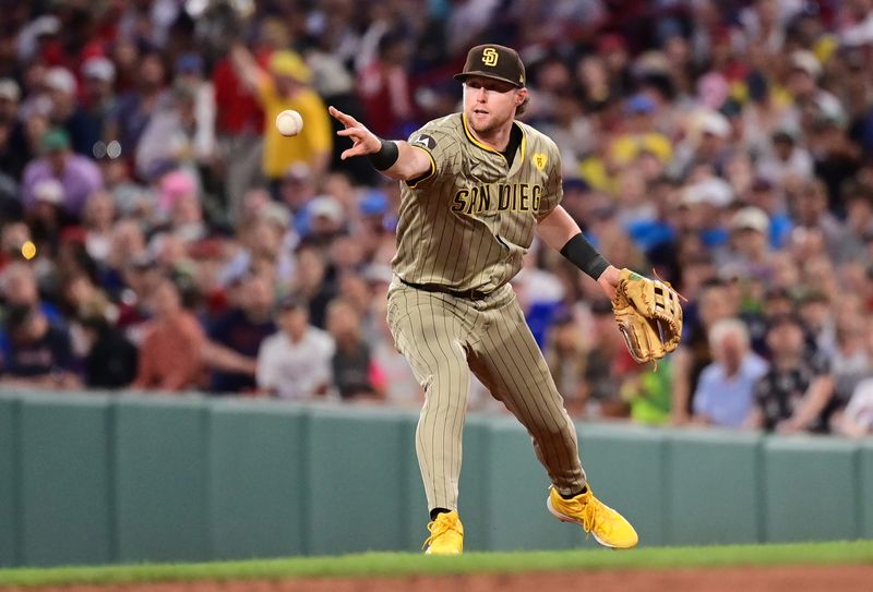 Jun 28, 2024; Boston, Massachusetts, USA; San Diego Padres second baseman Jake Cronenworth (9) tosses the ball to second base during the fifth inning against the Boston Red Sox at Fenway Park. Mandatory Credit: Eric Canha-USA TODAY Sports