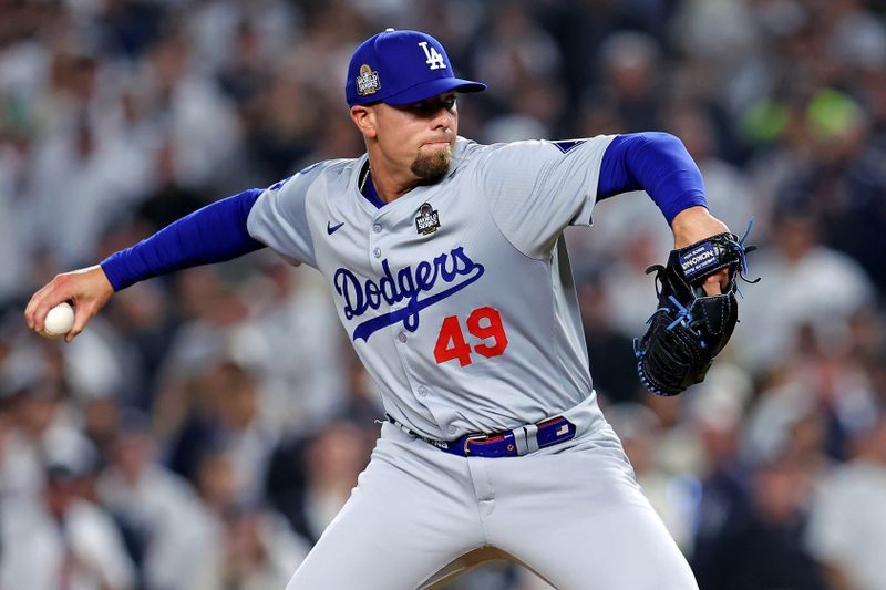 Oct 30, 2024; New York, New York, USA; Los Angeles Dodgers pitcher Blake Treinen (49) pitches during the sixth inning against the New York Yankees in game four of the 2024 MLB World Series at Yankee Stadium. Mandatory Credit: Brad Penner-Imagn Images