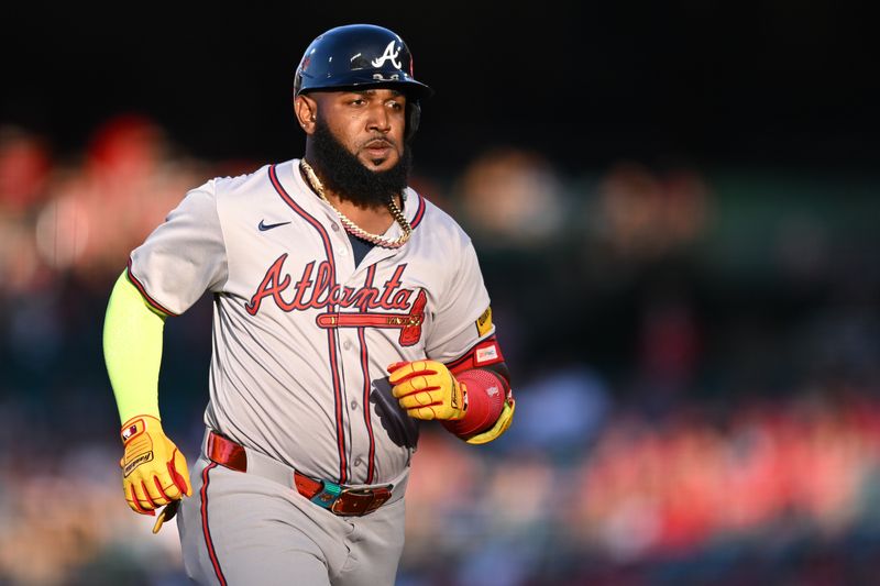 Aug 17, 2024; Anaheim, California, USA; Atlanta Braves designated hitter Marcell Ozuna (20) hits a 3 run home run against the Los Angeles Angels during the first inning at Angel Stadium. Mandatory Credit: Jonathan Hui-USA TODAY Sports