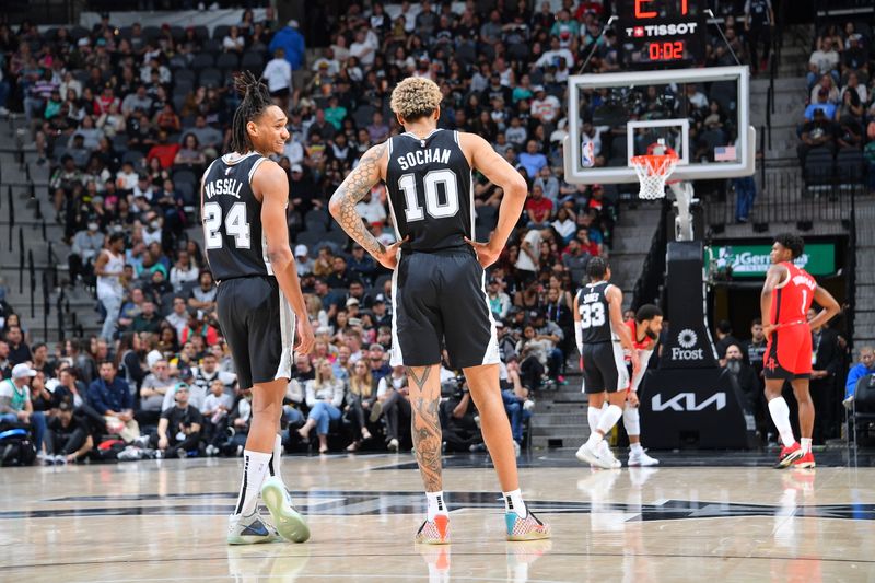 SAN ANTONIO, TX - MARCH 12: Devin Vassell #24 of the San Antonio Spurs talks with Jeremy Sochan #10 during the game against the Houston Rockets on March 12, 2024 at the Frost Bank Center in San Antonio, Texas. NOTE TO USER: User expressly acknowledges and agrees that, by downloading and or using this photograph, user is consenting to the terms and conditions of the Getty Images License Agreement. Mandatory Copyright Notice: Copyright 2024 NBAE (Photos by Michael Gonzales/NBAE via Getty Images)