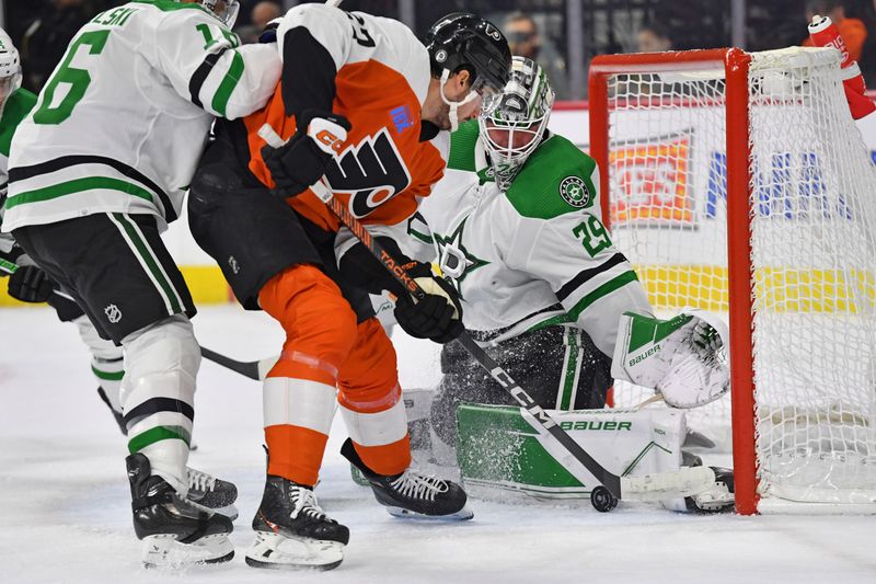 Jan 18, 2024; Philadelphia, Pennsylvania, USA; Dallas Stars goaltender Jake Oettinger (29) makes a save against Philadelphia Flyers left wing Noah Cates (27) during the first period at Wells Fargo Center. Mandatory Credit: Eric Hartline-USA TODAY Sports