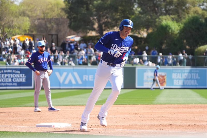 Mar 6, 2025; Phoenix, Arizona, USA; Los Angeles Dodgers first base Freddie Freeman (5) runs the bases after hitting a solo home run against the Texas Rangers during the third inning at Camelback Ranch-Glendale. Mandatory Credit: Joe Camporeale-Imagn Images