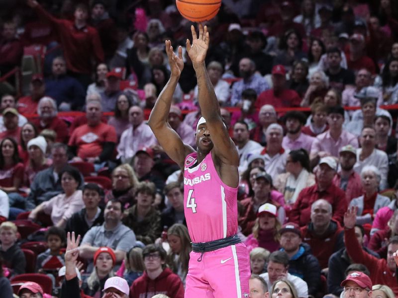 Jan 24, 2023; Fayetteville, Arkansas, USA; Arkansas Razorbacks guard Davonte Davis (4) shoots a three point shot in the second half against the LSU Tigers at Bud Walton Arena. Arkansas won 60-40. Mandatory Credit: Nelson Chenault-USA TODAY Sports