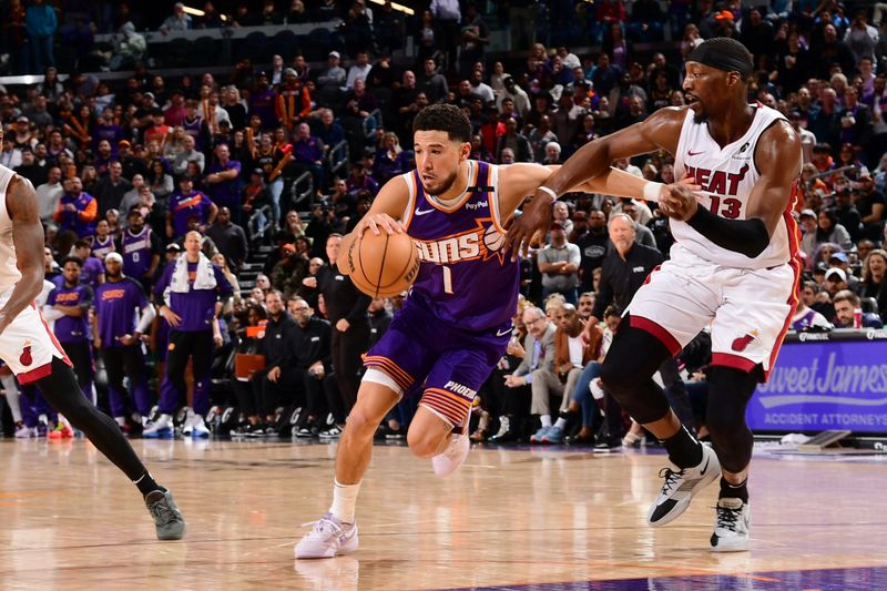 PHOENIX, AZ - NOVEMBER 6: Devin Booker #1 of the Phoenix Suns drives to the basket during the game against the Miami Heat on November 6, 2024 at Footprint Center in Phoenix, Arizona. NOTE TO USER: User expressly acknowledges and agrees that, by downloading and or using this photograph, user is consenting to the terms and conditions of the Getty Images License Agreement. Mandatory Copyright Notice: Copyright 2024 NBAE (Photo by Kate Frese/NBAE via Getty Images)