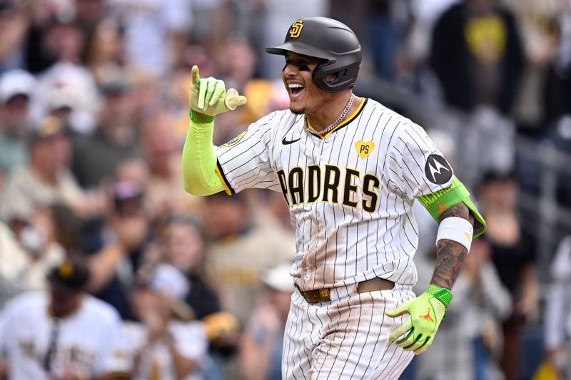 Sep 18, 2024; San Diego, California, USA; San Diego Padres third baseman Manny Machado (13) celebrates after hitting a home run against the Houston Astros during the eighth inning at Petco Park. Mandatory Credit: Orlando Ramirez-Imagn Images