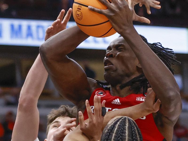Mar 9, 2023; Chicago, IL, USA; Rutgers Scarlet Knights center Clifford Omoruyi (11) drives to the basket against Michigan Wolverines guard Kobe Bufkin (2) during the first half at United Center. Mandatory Credit: Kamil Krzaczynski-USA TODAY Sports