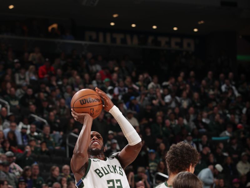 MILWAUKEE, WI - APRIL 5: Khris Middleton #22 of the Milwaukee Bucks shoots the ball during the game against the Toronto Raptors on April 5, 2024 at the Fiserv Forum Center in Milwaukee, Wisconsin. NOTE TO USER: User expressly acknowledges and agrees that, by downloading and or using this Photograph, user is consenting to the terms and conditions of the Getty Images License Agreement. Mandatory Copyright Notice: Copyright 2024 NBAE (Photo by Gary Dineen/NBAE via Getty Images). 