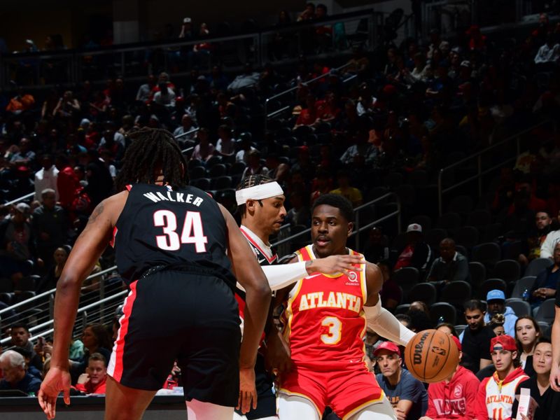 ATLANTA, GA - MARCH 3: Aaron Holiday #3 of the Atlanta Hawks dribbles the ball during the game Pagainst the Portland Trail Blazers on March 3, 2023 at State Farm Arena in Atlanta, Georgia.  NOTE TO USER: User expressly acknowledges and agrees that, by downloading and/or using this Photograph, user is consenting to the terms and conditions of the Getty Images License Agreement. Mandatory Copyright Notice: Copyright 2023 NBAE (Photo by Scott Cunningham/NBAE via Getty Images)