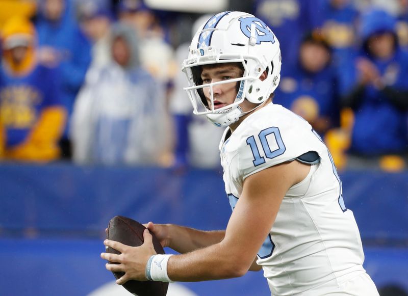 Sep 23, 2023; Pittsburgh, Pennsylvania, USA; North Carolina Tar Heels quarterback Drake Maye (10) warms up before the game against the Pittsburgh Panthers at Acrisure Stadium. Mandatory Credit: Charles LeClaire-USA TODAY Sports