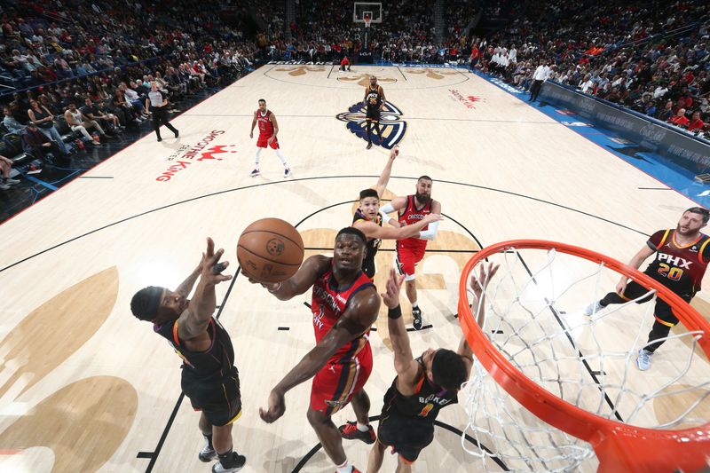 NEW ORLEANS, LA - APRIL 1:  Zion Williamson #1 of the New Orleans Pelicans drives to the basket during the game against the Phoenix Suns on April 1, 2024 at the Smoothie King Center in New Orleans, Louisiana. NOTE TO USER: User expressly acknowledges and agrees that, by downloading and or using this Photograph, user is consenting to the terms and conditions of the Getty Images License Agreement. Mandatory Copyright Notice: Copyright 2024 NBAE (Photo by Layne Murdoch Jr./NBAE via Getty Images)