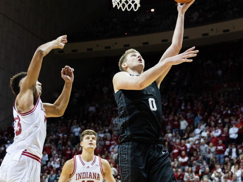 Jan 22, 2023; Bloomington, Indiana, USA; Michigan State Spartans forward Jaxon Kohler (0) shoots the ball while Indiana Hoosiers forward Trayce Jackson-Davis (23) defends in the second half at Simon Skjodt Assembly Hall. Mandatory Credit: Trevor Ruszkowski-USA TODAY Sports