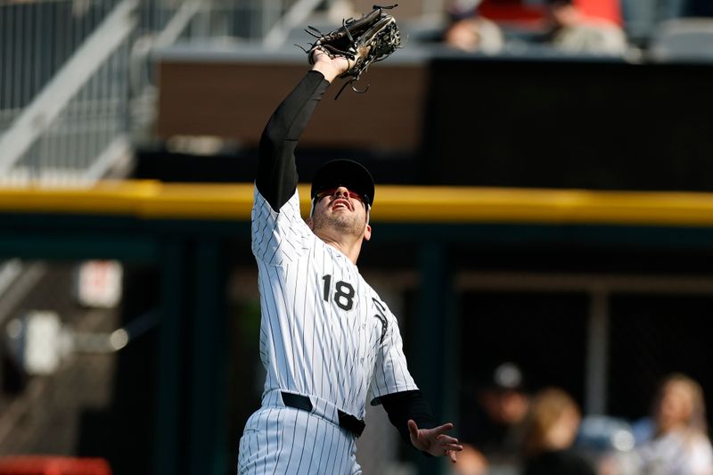 May 24, 2025; Chicago, Illinois, USA; Chicago White Sox right fielder Mike Tauchman (18) catches a fly ball hit by Texas Rangers first baseman Jake Burger during the third inning at Rate Field. Mandatory Credit: Kamil Krzaczynski-Imagn Images