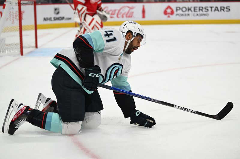 Oct 24, 2023; Detroit, Michigan, USA; Seattle Kraken left wing Pierre-Edouard Bellemare (41) struggles to get off the ice after being injured against the Detroit Red Wings in the first period at Little Caesars Arena. Mandatory Credit: Lon Horwedel-USA TODAY Sports