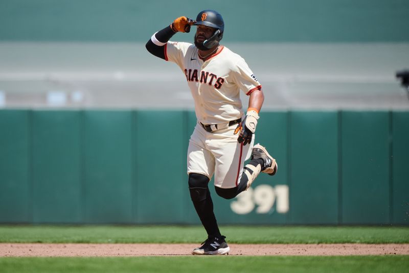 May 19, 2024; San Francisco, California, USA; San Francisco Giants outfielder Heliot Ramos (17) gestures toward the Giants dugout after hitting a one run home run against the Colorado Rockies during the sixth inning at Oracle Park. Mandatory Credit: Robert Edwards-USA TODAY Sports