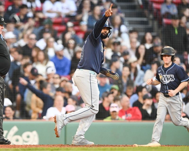 Sep 28, 2024; Boston, Massachusetts, USA; Tampa Bay Rays shortstop Junior Caminero (13) reacts after scoring a run against the Boston Red Sox during the fifth inning at Fenway Park. Mandatory Credit: Brian Fluharty-Imagn Images