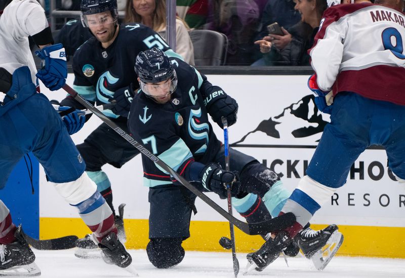 Oct 22, 2024; Seattle, Washington, USA;  Seattle Kraken forward Jordan Eberle (7) battles for the pucks with Colorado Avalanche defenseman Cale Makar (8) during the second period at Climate Pledge Arena. Mandatory Credit: Stephen Brashear-Imagn Images