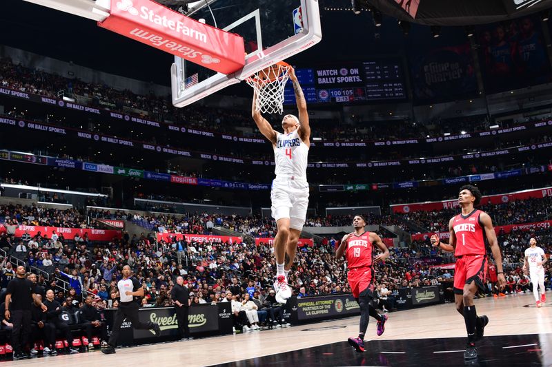 LOS ANGELES, CA - APIRL 14: Brandon Boston Jr. #4 of the LA Clippers dunks the ball during the game against the Houston Rockets on April 14, 2024 at Crypto.Com Arena in Los Angeles, California. NOTE TO USER: User expressly acknowledges and agrees that, by downloading and/or using this Photograph, user is consenting to the terms and conditions of the Getty Images License Agreement. Mandatory Copyright Notice: Copyright 2024 NBAE (Photo by Adam Pantozzi/NBAE via Getty Images)